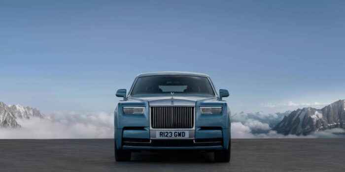 Front view of a 2025 Rolls-Royce Phantom parked in a mountain setting, showcasing elite styling that reflects rolls-royce price status.